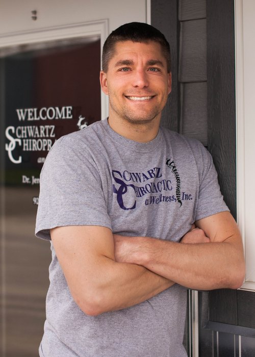 Dr. Jeremie Schwartz outside Schwartz Chiropractic and Wellness in Watertown